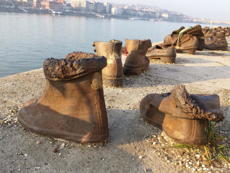 Also, on the edge of the beautiful Danube, almost in front of the back of the Parliament, you can see a homage to the Jews killed by the fascist Arrow Cross during the WWII, the monument Shoes on the Danube Bank. The Jews, back then, were ordered to take off their shoes, and were shot at the edge of the water so that their bodies fell into the river to be carried away. There are sixty pairs of iron shoes created by the sculptor Gyula Pauer. In my opinion, one of the most moving monuments within the city.