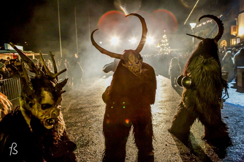 Please meet Krampus, Santa Claus’ shadow. Krampus is horrific beast that is half-demon and half-goat who, literally, beats children up from naughty to nice. Krampus isn’t exactly what you expect for Christmas, I assure you. Dark long fur, horns and fangs, this creature is St. Nicholas’ shadow and it comes with a chain and cow-bells that he whip about, along with a bunch of birch sticks meant to hit naughty children. It then kidnaps the bad kids and take them down to the underworld.