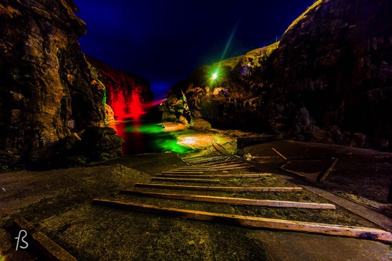 The gorge that gives name to the village is one of the best natural harbors in the Faroe Islands. But things are not that simple. Boats need to be pulled up on a ramp to keep them safe from the water. During the night, there are colorful lights all around and they make the gorge even more beautiful. An amazing opportunity to take even more pictures. 