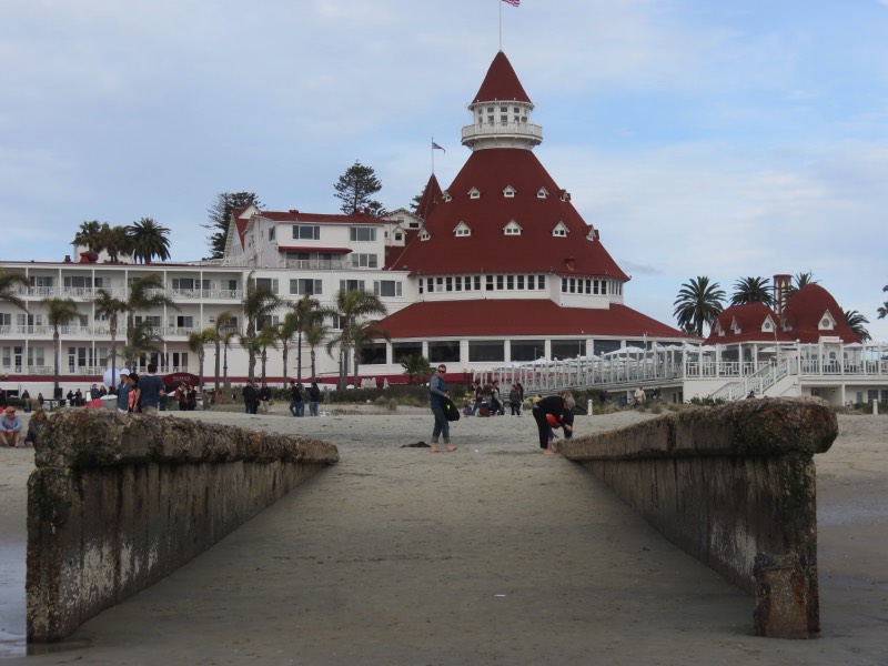 A Visit to Coronado Island Coronado Island is a beautiful neighborhood of San Diego which can be reached by crossing the sweeping Coronado bridge. Homes in Coronado have steep prices, and it's no wonder -- everyone is within walking distance of the beach. The most famous landmark is the historic Hotel del Coronado, with its Victorian architecture and storied past. Marilyn Monroe once filmed a movie there! A visit to Coronado Island must include a stroll down Orange Avenue to see the many boutique shops and art galleries. Renting a bicycle is also a great way to get around.
