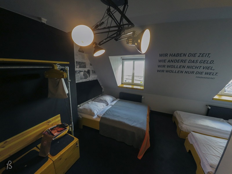 When I entered my room, I knew I had made the right choice. Inside my room, there were three beds, two small ones and a large one where I decided to sleep. The walls are covered in newspaper articles mentioning sights and stories from Hamburg. I loved the yellow boxed that can be used to store your bags and have keys to make everything safer. Inside the bathroom everything was clean, and the shower was as powerful as it can be. But, the thing that caught my eye was the small bag close to the sink. There you can find what can be only described as a rescue package, featuring tampons and condoms! If you forgot about it, Superbude didn’t forget about you!