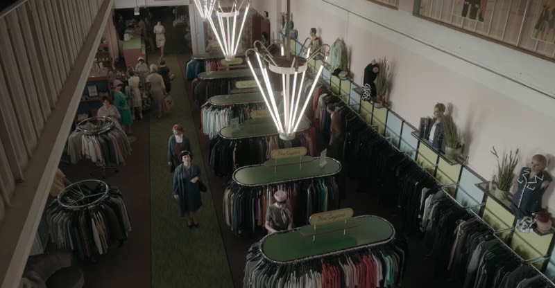 I believe it happens in the second episode when Beth’s adoptive mother takes her shopping. There is an outside scene where they cross a road that is clearly not in Berlin. But once they are in the shop, they are back in Germany. The exterior shots were done in Toronto, but inside, they are in Berlin-Friedrichshain.