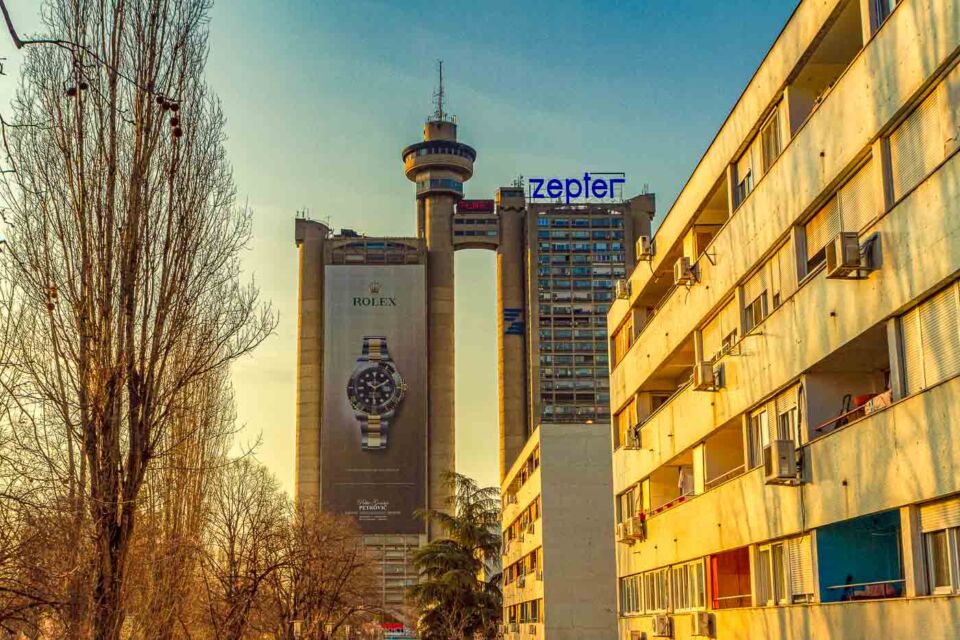 The Western City Gate, also known as Genex Tower or Kula Geneks in Serbian, is a massive skyscraper in Belgrade and can be seen from all around town. The 35 storeys tall building is an icon of architectural brutalism with its two connected towers and even a revolving restaurant that feels like a crown over everything.